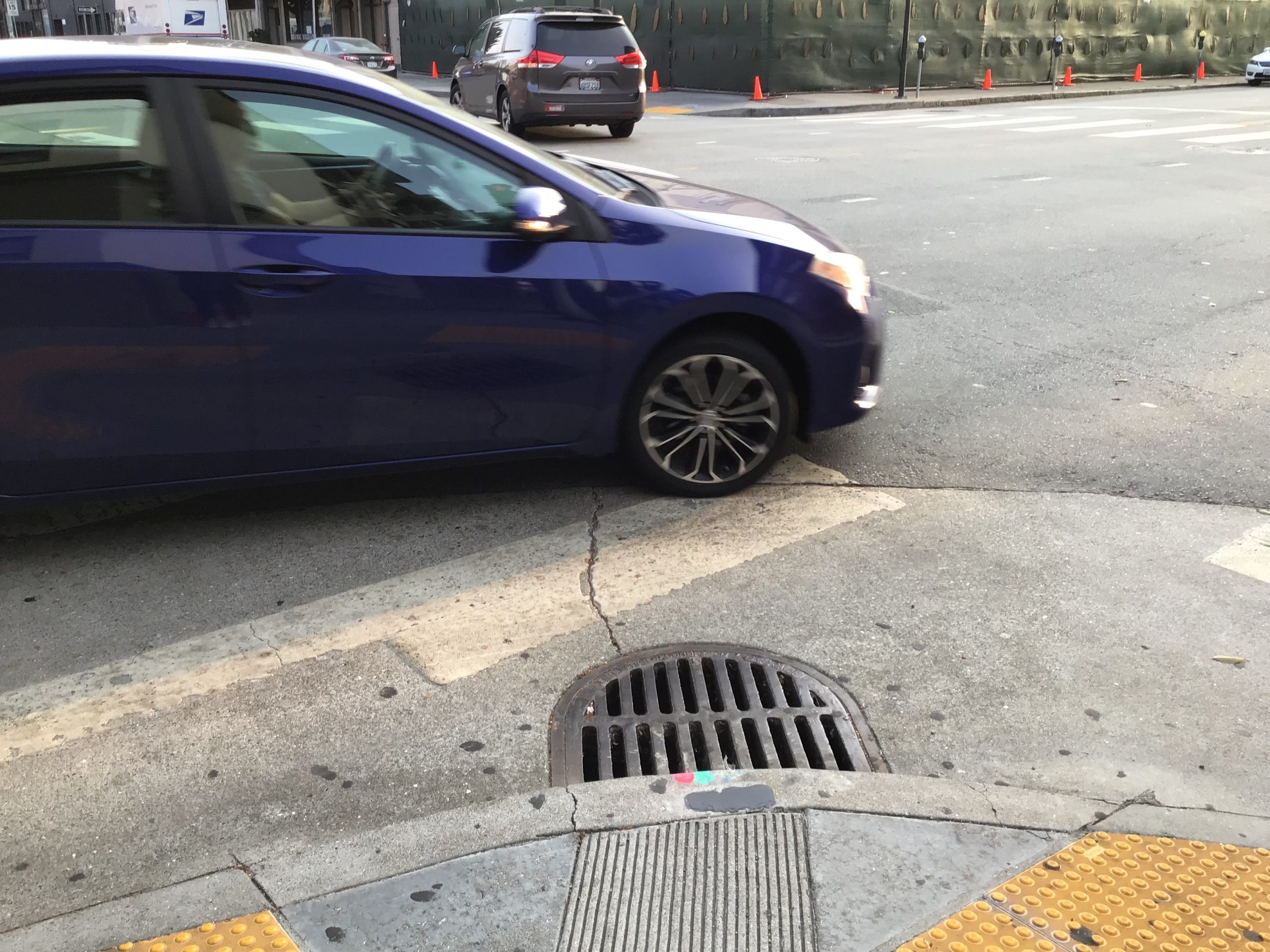 car and stormdrain picture